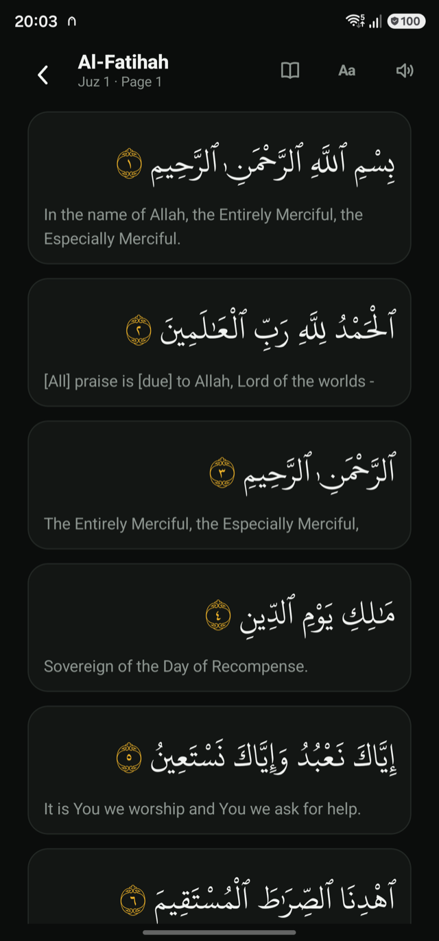 The reader in the dark theme, the translation beneath each ayah